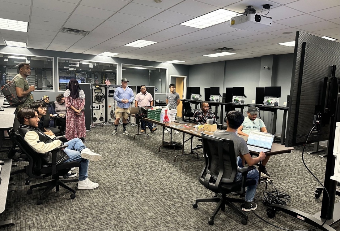 Students meet to strategize for the league's cyber security competition.