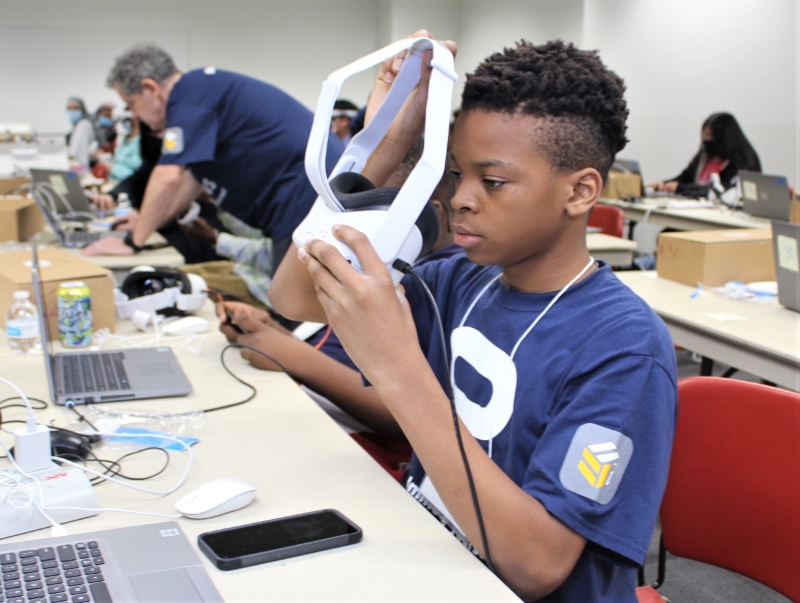 A student puts on a VR headset.