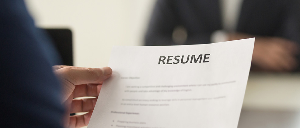 Image of a job candidate holding a resume