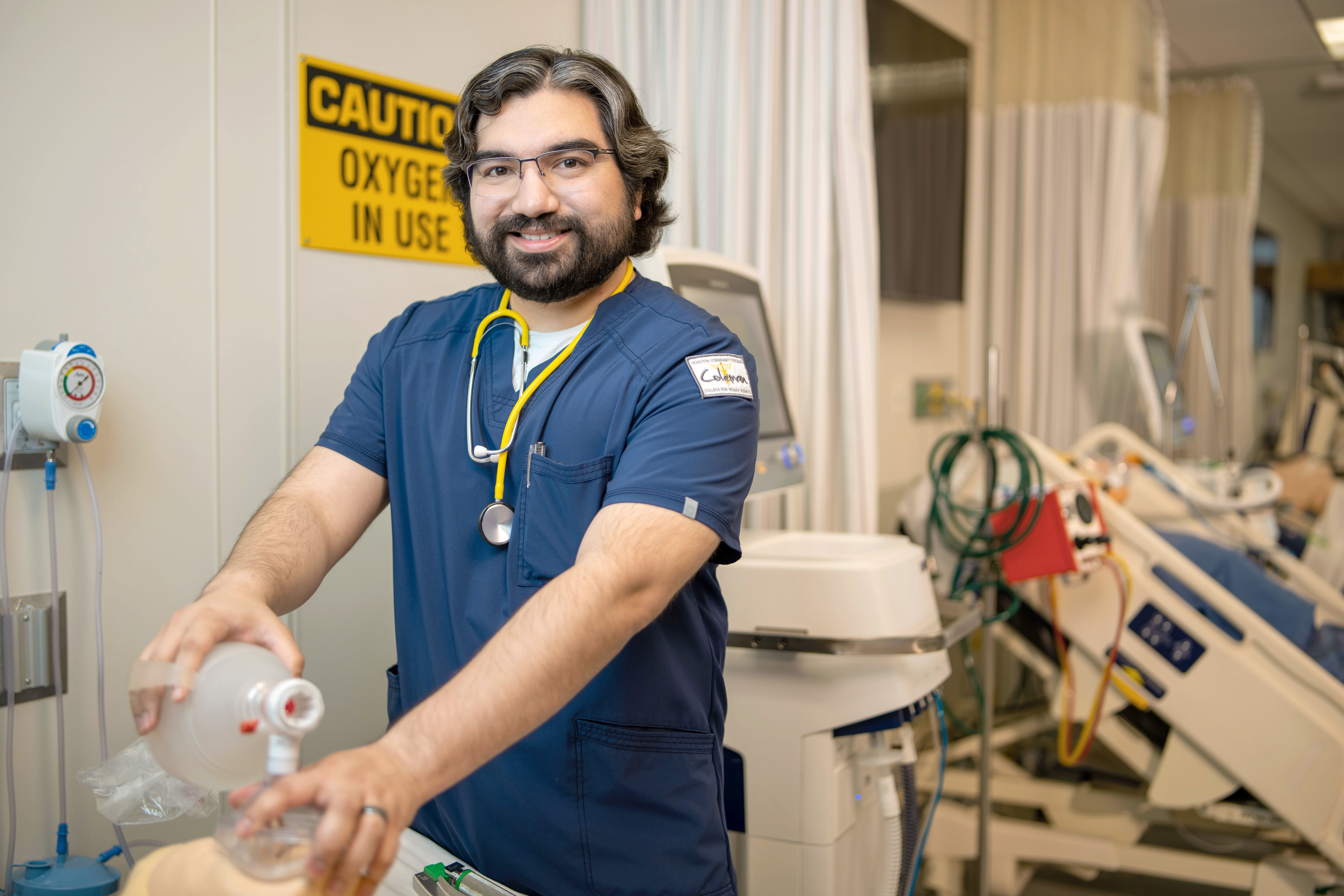Respiratory Therapy student practicing on a medical training mannequin